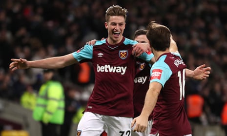 Reece Burke celebrates his extra-time winner with West Ham captain Mark Noble.