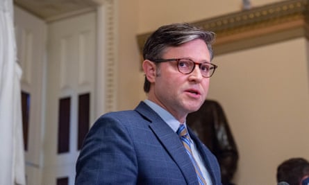 Mike Johnson, who has just been elected speaker of the US House of Representatives, walks through a room.