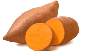 Whole sweet potato and slices isolated on white background