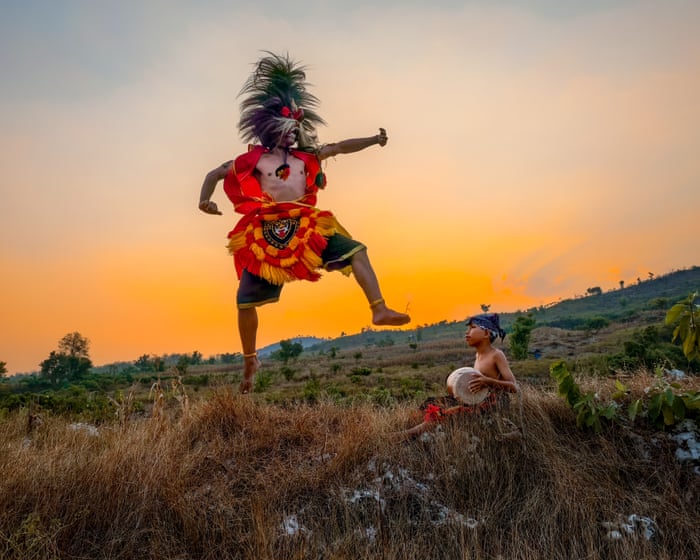 Image accompanying the story: A theatrical dancer on a pristine limestone mountain in East Java: Mohammad Nur Nasikin’s best phone picture