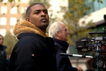 Noel Clarke wearing a dark jacket on a film set