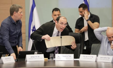 Simcha Rothman holds the Declaration of Independence of the State of Israel during a Knesset debate on the justice system in March.