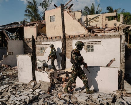 Soldiers from the Karen National Union patrol a ruined monastery