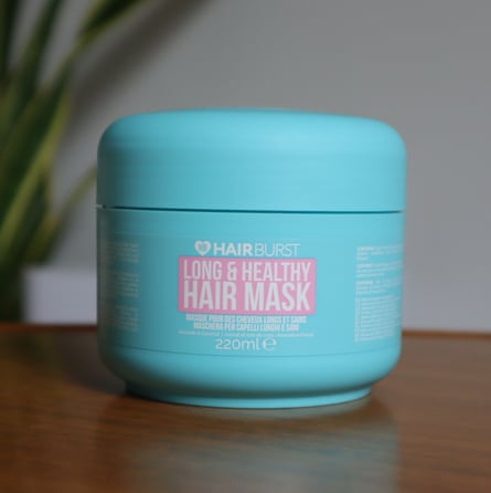 A tub of best hair mask – Hair Burst. The pot is bright blue with a light pink square and white text.