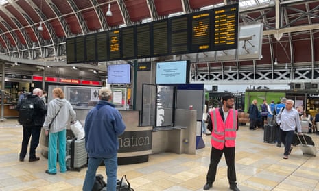 Passengers wait at Paddington station, London, after no trains could enter or leave because of damage to overhead electric wires near Hayes and Harlington