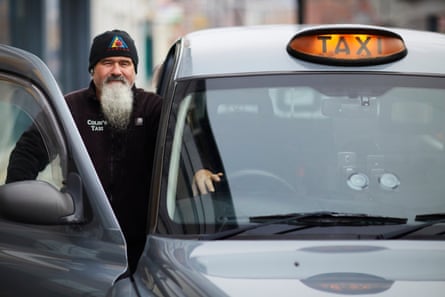 Colin Turnbull with his taxi. He says he will not ask passengers where they are from because ‘that’s not our job. We aren’t the police.'