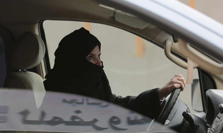 One of the released activists, Aziza al-Yousef, drives a car in Riyadh as part of a campaign to defy Saudi Arabia’s then ban on women driving. 