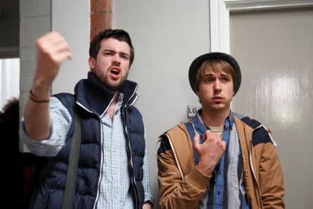 The two standing, Whitehall looking as if he is shouting something and Thomas gazing ahead.