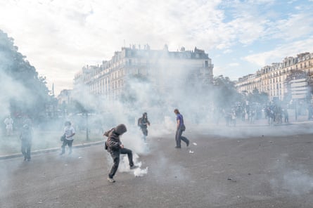 Protesters battle teargas during demonstrations in Paris.