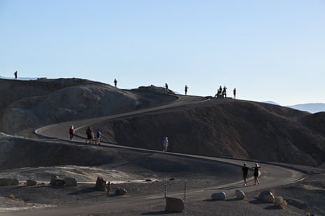 Tourists visit Zabriskie Point in Death Valley, California, one of the hottest regions in the US.