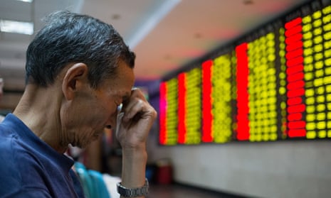 A Chinese investor reacts to a slump in share prices.