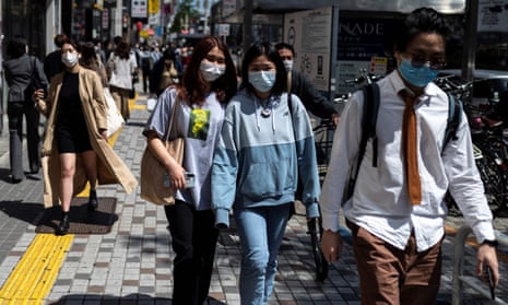 Pedestrians in Tokyo’s Shinjuku are