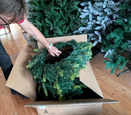 Alan removes a Christmas tree from its box