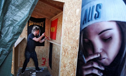 A Christiania resident demolishes a cannabis stall following the shooting.