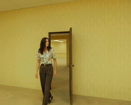 Woman in sparsely decorated room