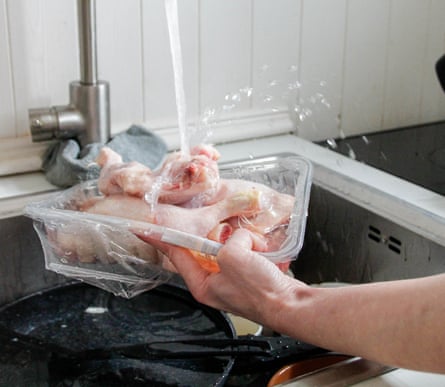 Washing chicken with tap water