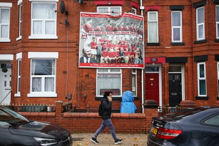 A house in Manchester with a banner dedicated to Sir Bobby Charlton.