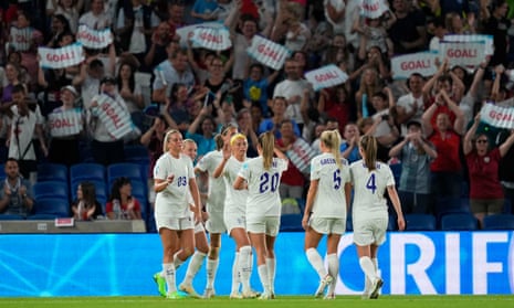The England players celebrate after scoring one of their eight goals against Norway in their second group game.  
