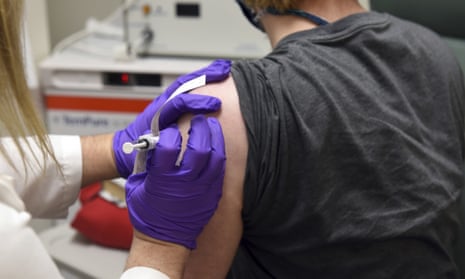The first patient enrolled in Pfizer’s coronavirus vaccine clinical trial receives an injection in Baltimore, Maryland, on 4 May. 