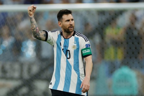 Lionel Messi raises a fist after scoring at last.