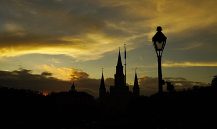A silhouette of a cathedral with storm clouds