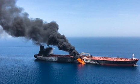 Smoke billowing from Norwegian-owned Front Altair tanker, said to have been attacked in the waters of the Gulf of Oman