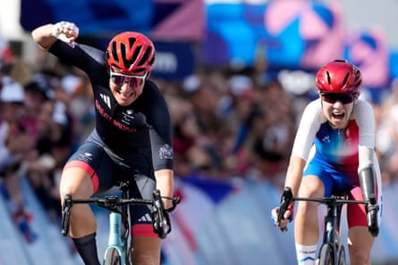 Sarah Storey punches the air after chasing down and outsprinting Heïdi Gaugain to win the women’s C4-5 road race gold medal at the line in Paris.