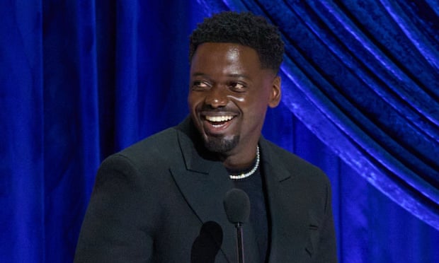 Daniel Kaluuya accepts the best supporting actor Oscar.
