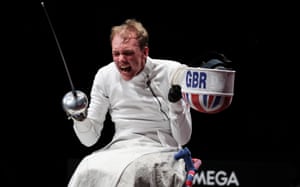 An overjoyed Piers Gilliver of Great Britain celebrates after winning the Men’s Épée Individual Category A Gold Medal against Maxim Shaburov of Team RPC.