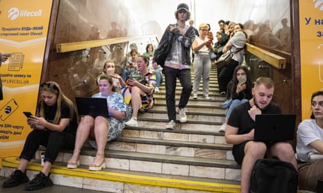 People take cover at metro station during a Russian rocket attack in Kyiv, Ukraine, on Monday.