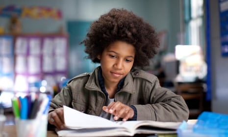 Black boy with afro in classroom