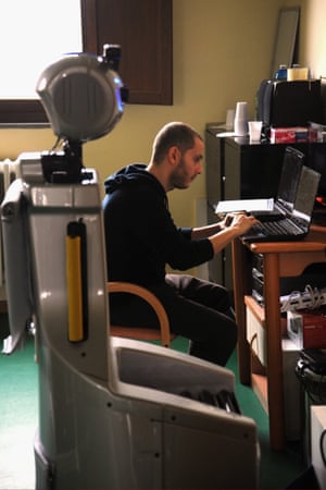 Raffaele Esposito, an assistant researcher of the Scuola Superiore Sant’Anna di Pisa, controls the robot.