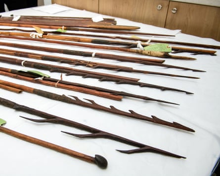 A table with spears and other artefacts on it