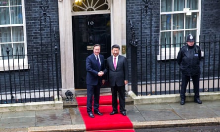 The red carpet is rolled out as David Cameron greets Chinese President Xi Jinping at Downing Street in London.