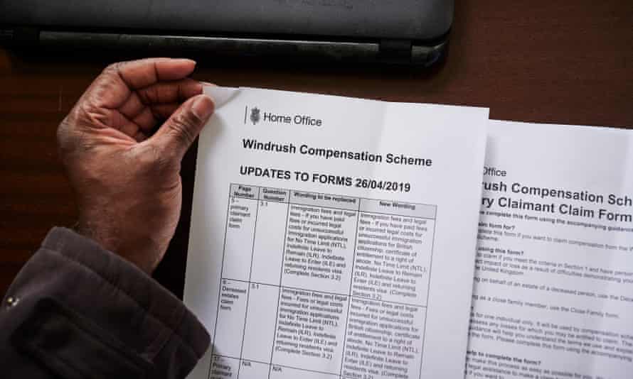 Anthony Brown holds documents related to the Windrush compensation scheme