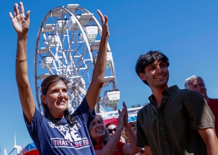 Republican presidential candidate Nikki Haley tours Thrillville at the Iowa state fair with her son Nalin, in Des Moines.