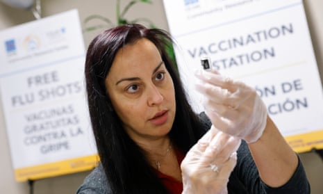 A healthcare worker prepares a dose of the updated vaccine.