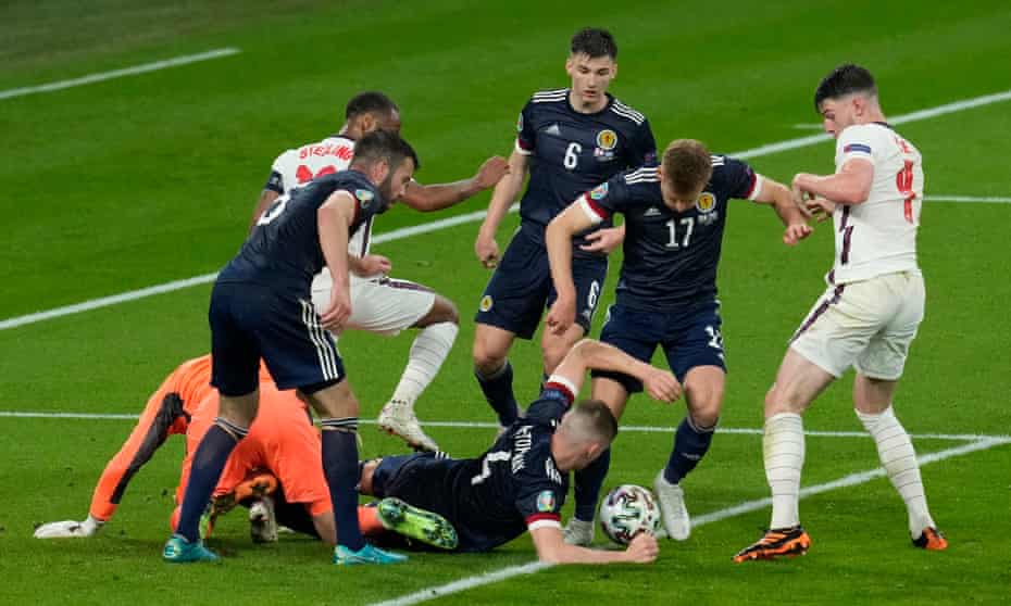 Scotland try to clear the ball in added time against England