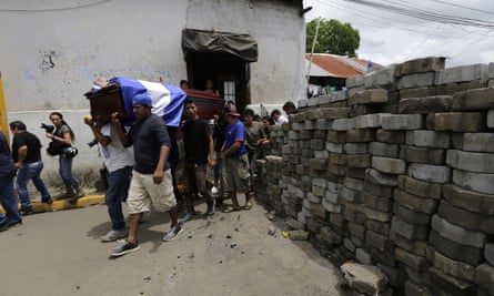 Friends and relatives of Jorge Carrión, 33, shot dead during protests against the government of President Daniel Ortega, carry his coffin during the funeral in Masaya on 7 June.