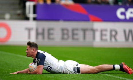 England’s Jack Welsby dives in to score his side’s first try.