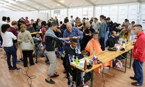 Hairdressers from Duesseldorf cut hair for free at a refugee accommodation centre.
