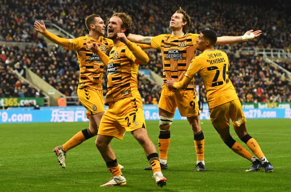 Joe Ironside (second right) celebrates what proved to be Cambridge United’s winning goal with (from left) James Brophy, Ben Worman and Harvey Knibbs.