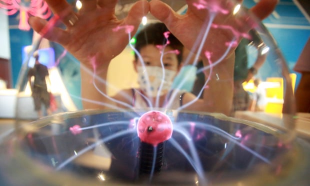 A child interacts with an installation at Yangzhou Science and Technology Museum