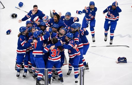 The US women’s team celebrate their victory against Canada.