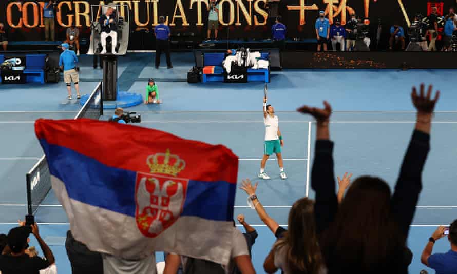 Novak Djokovic is cheered by supporters after winning his semi-final match.