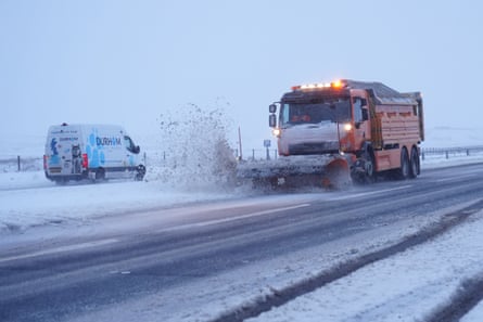 A snow plough clears a road