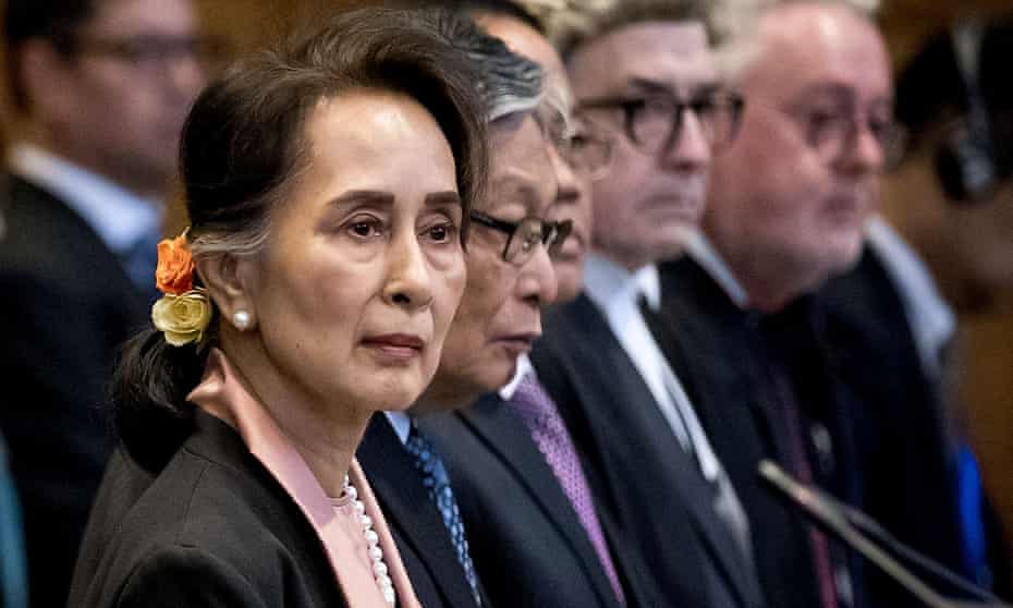 Aung San Suu Kyi listens in court