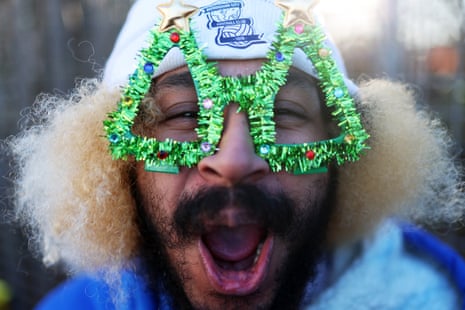 A Birmingham City fan arrives wearing tinsel-framed specs ahead of his team’s match against Derby County at St Andrew’s.