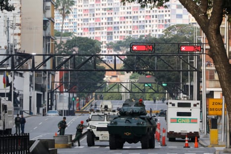 National Guard armoured vehicles block an avenue leading to Miraflores presidential palace in Caracas, Venezuela, on Saturday.