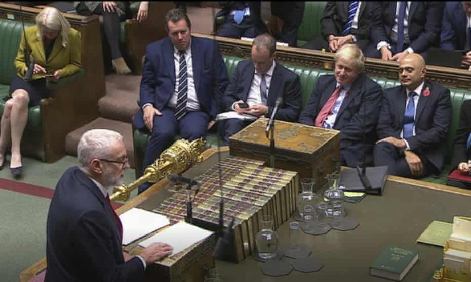 Boris Johnson listens to Jeremy Corbyn in the House of Commons on Tuesday.